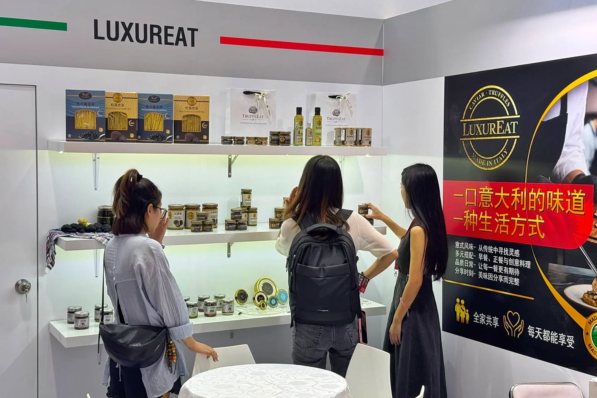 Visitors discovering products at the LuxurEat booth